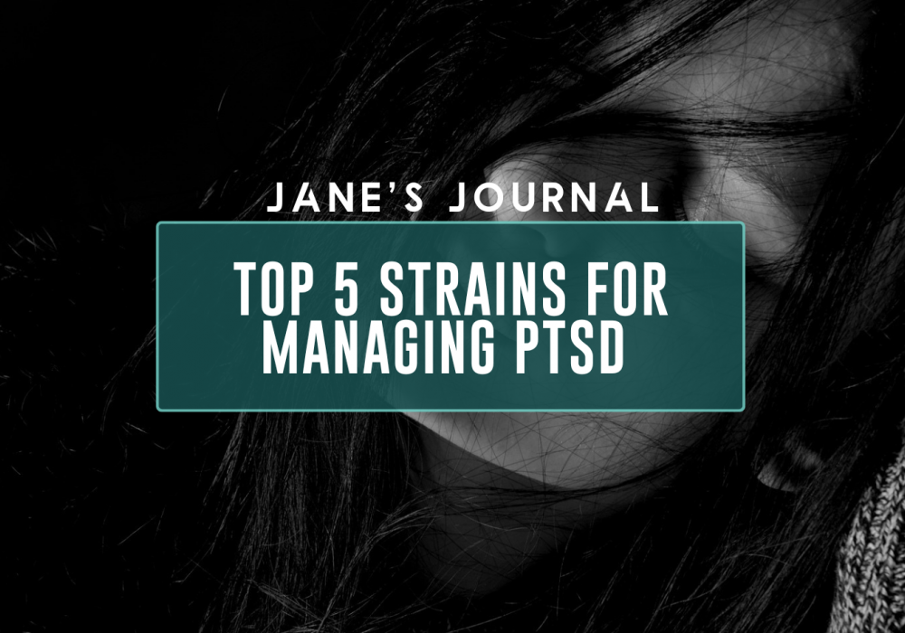 This is a black and white image of a white woman with long dark hair holding her head with a sense of sadness and frustration.