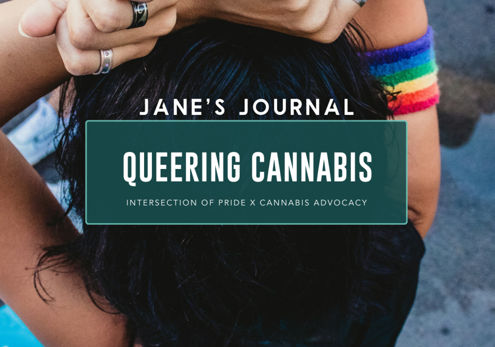 A birds-eye view looking down an individual wearing accessories including metal rings and rainbow print colored wristbands.