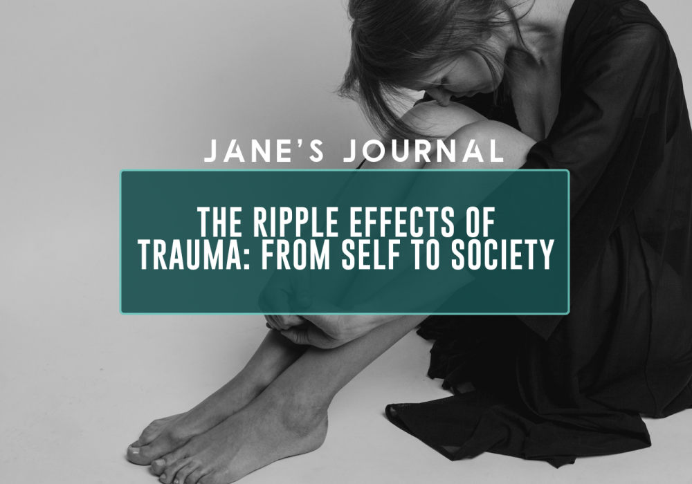 black and white emotive photo of woman holding legs, head to knees