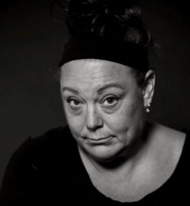 Black and white portrait of an Elder Jane looking into the camera