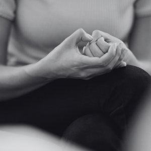 Woman nervously picking fingers