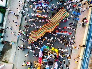 humans gathering in the street in support of PRIDE and LGBTQ+ rights